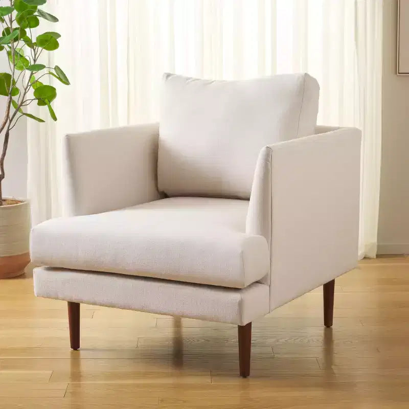 Poltrona imbottita in lino con gambe in legno