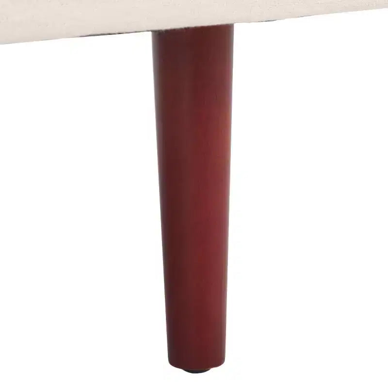 Poltrona imbottita in lino con gambe in legno