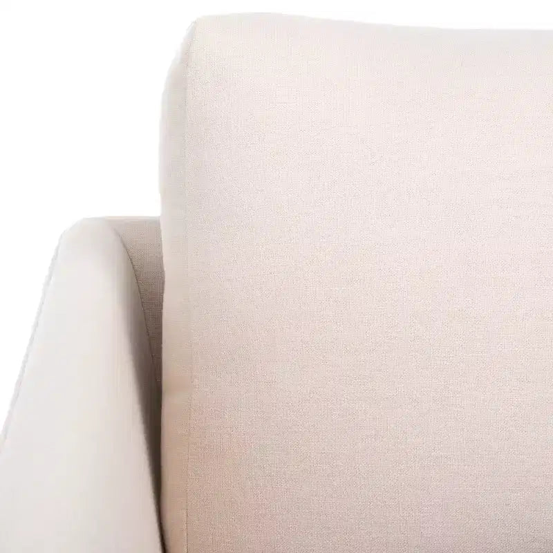 Poltrona imbottita in lino con gambe in legno